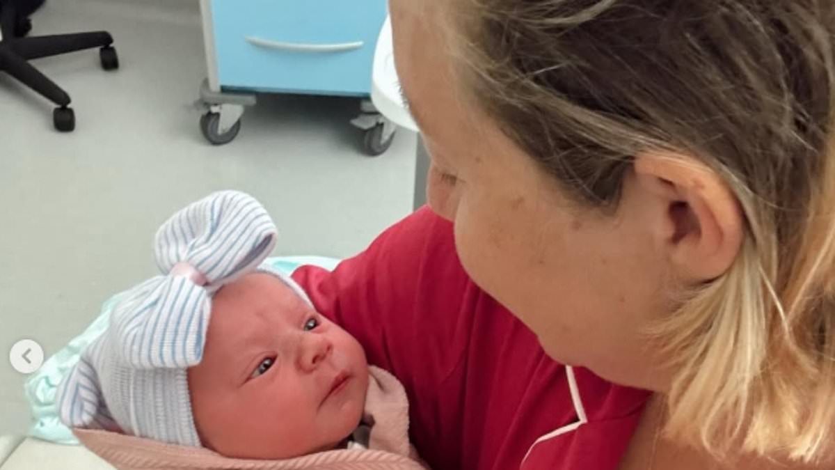 Kelsey Parker embraces her rainbow baby River after tragedy