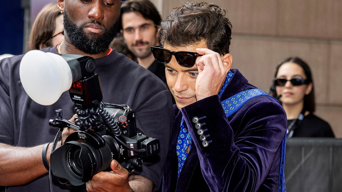 Rami Malek freezes TIFF to stare at paparazzo photo hinting obsession